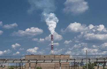 a smoking factory chimney