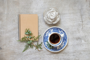Obraz na płótnie Canvas cup of coffee with a notebook