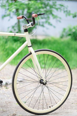 Fototapeta na wymiar bicycle wheel on a background of grass