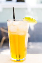 Cocktail. Orange juice with mint and ice rustic wooden table