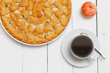 Cup of coffee and homemade pie with apples and pears