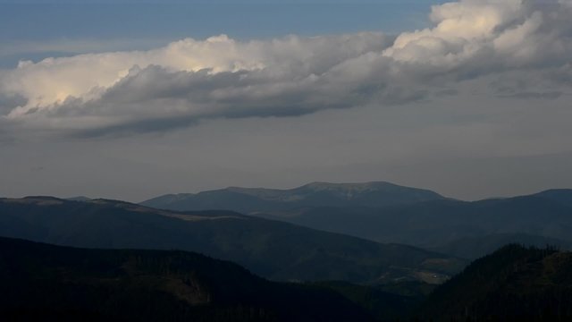 Time lapse of cumulus clouds bubbling over Carpathian Mountains