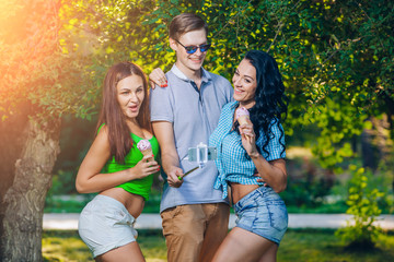 Group of friends taking picture themselves with monopod use