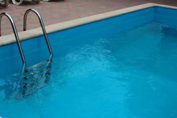 Fototapeta na wymiar Swimming pool ladder