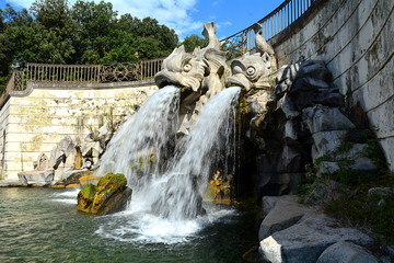 Fototapeta na wymiar Te baroque fountain and the staue of the royal palace in Caserta, Italy