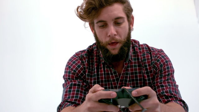 Bearded hipster playing video games