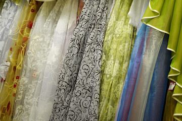 Tulle transparent fabric. It is used for windows. Background. White, green, blue, red.
