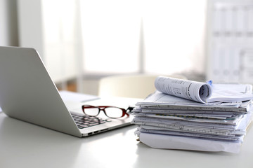 office desk a stack of computer paper reports work forms