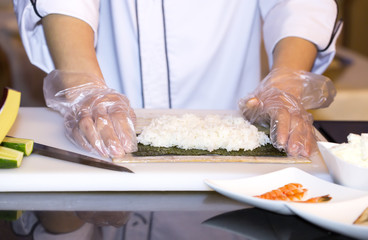 Japanese chef preparing a meal in a restaurant