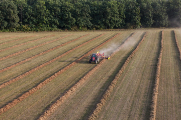 aerial view of harvest fields with tractor