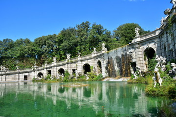 Te baroque fountain and the staue of the royal palace in Caserta, Italy - 90421460