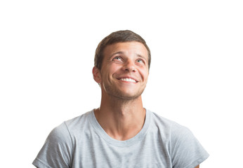 Portrait of smiling happy young man looking up - isolated on whi