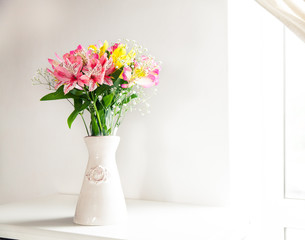 Alstroemeria flowers in vase on table