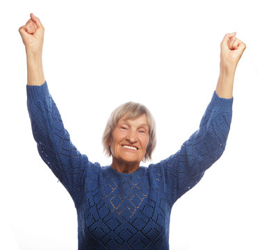 Senior Woman Gesturing Victory Over White Background