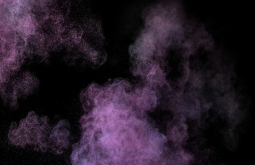 Pink Makeup powder explosion isolated on black background