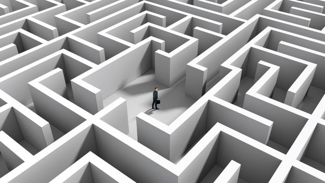 Businessman standing in middle of maze
