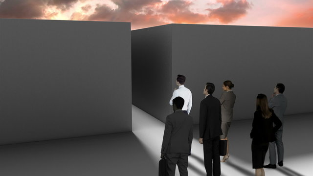 Business people at entrance of maze