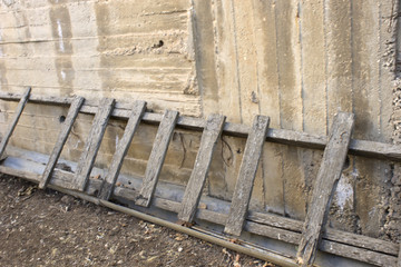 This is a photograph of an old wooden stepladder