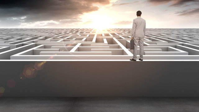 Businessman at entrance of maze