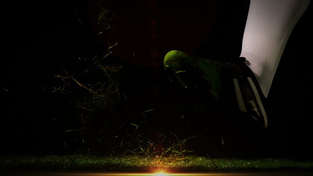 Player kicking georgia rugby ball 