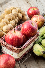 Assorted fresh fruit natural background wood floors.