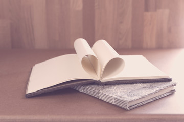 Open notebook on grunge background,vintage style..