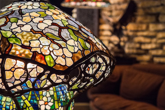 Detail of lit Tiffany-style stained leaded glass lamp