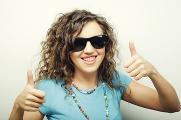  beautiful young woman showing thumbs up gesture
