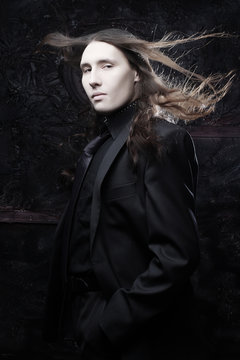 portrait of a fashionable male model with long hair 
