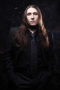 portrait of a fashionable male model with long hair 
