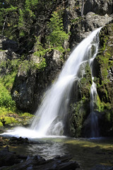 Fototapeta na wymiar Scenic Muehtinsky waterfall in Altai Republic.