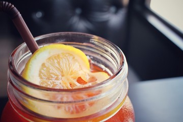 Ice tea with lemon on a jar