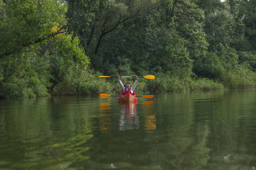 Fototapeta na wymiar The couple goes kayaking on the river.