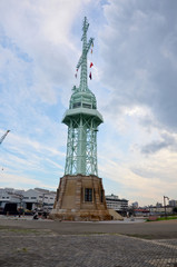 Fototapeta na wymiar Lighthouse tower at Kobe Harborland