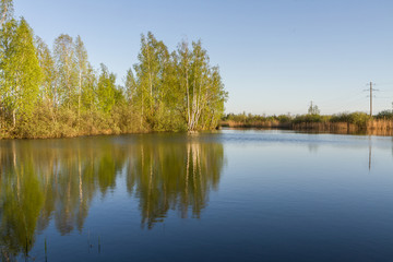 Fototapeta na wymiar Small lake in summer day