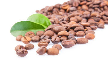 Coffee beans and green leaves