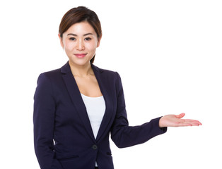 Young businesswoman with hand showing blank sign