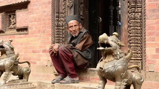 Old Monk on the steps of the temple