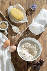 top view, ingredients to make a cake on a wooden table