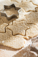 close up of a cookie cutter and a cake dough