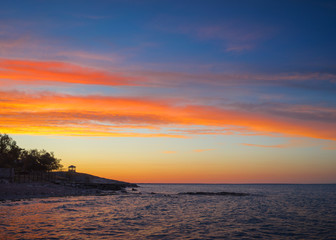 Beautiful sunset on the coast of a tropical resort
