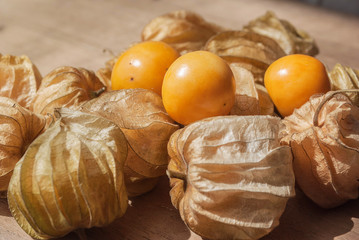 Cape gooseberry (Physalis) on wooden table, healthy fruit and ve