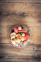 Fototapeta na wymiar variety of candies on a wooden background 