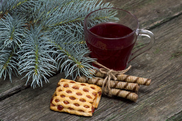 cup of tea a fir-tree branch and cookies