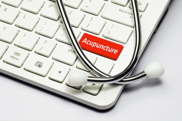 Keyboard, Acupuncture text and Stethoscope