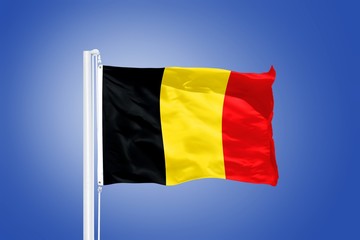 Flag of Belgium flying against a blue sky
