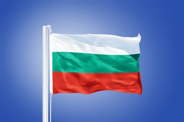 Flag of Bulgaria flying against a blue sky