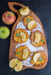 Pancakes with apples sprinkled with icing sugar