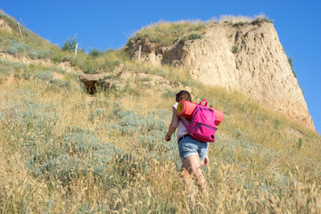 Naklejka na ściany i meble a woman climbs the hill