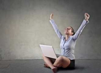 Happy employee using her pc